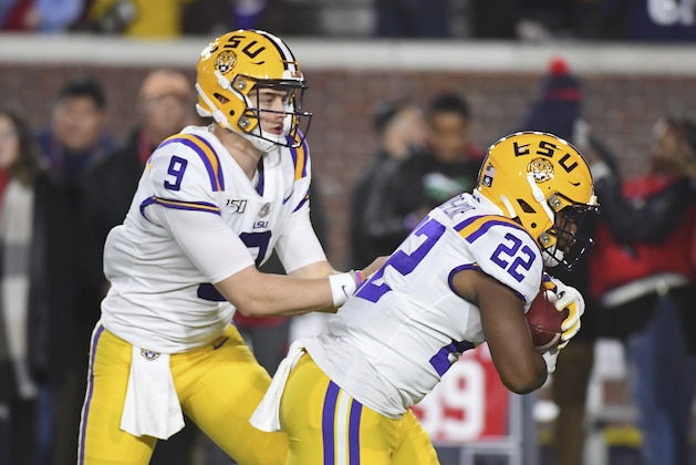 LSU quarterback Joe Burrow (9) hands the ball off to running back Clyde Edwards-Helaire (22) during warm ups before an NCAA college football game in Oxford, Miss., Saturday, Nov. 16, 2019. (AP Photo/Thomas Graning)