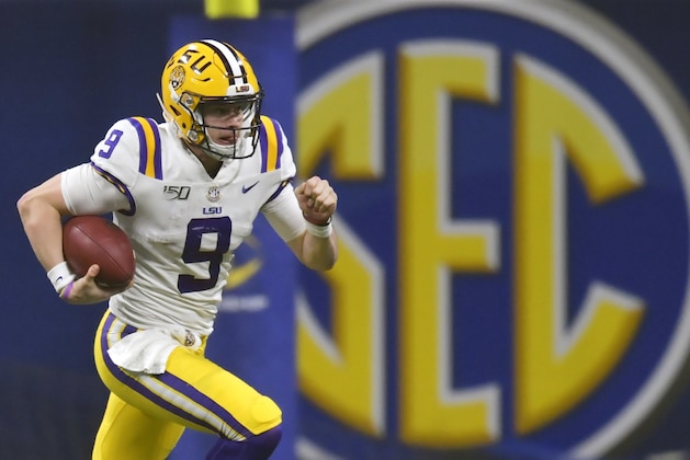 FILE - In this Dec. 7, 2019, file photo, LSU quarterback Joe Burrow (9) runs against Georgia during the second half of the Southeastern Conference championship NCAA college football game, in Atlanta. Burrow is a unanimous selection as the offensive player of the year on The Associated Press All-Southeastern Conference football team, Monday, Dec. 9, 2019. (AP Photo/Mike Stewart, File)