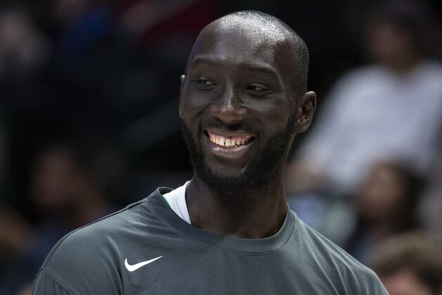 Boston Celtics center Tacko Fall stands on the court before an NBA basketball game against the Dallas Mavericks Wednesday, Dec. 18, 2019, in Dallas. (AP Photo/Sam Hodde) Boston Celtics center Tacko Fall stands on the court before an NBA basketball game against the Dallas Mavericks Wednesday, Dec. 18, 2019, in Dallas. (AP Photo/Sam Hodde)