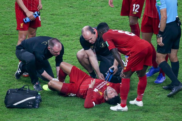 Liverpool's midfielder Alex Oxlade-Chamberlain receives treatment on the field during the 2019 FIFA Club World Cup Final football match between England's Liverpool and Brazil's Flamengo at the Khalifa International Stadium in the Qatari capital Doha on December 21, 2019. (Photo by Mustafa ABUMUNES / AFP) (Photo by MUSTAFA ABUMUNES/AFP via Getty Images)