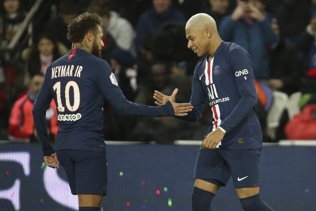 PARIS, FRANCE - DECEMBER 21: Kylian Mbappe of PSG celebrates his goal with Neymar Jr (left) during the Ligue 1 match between Paris Saint-Germain (PSG) and Amiens SC at Parc des Princes stadium on December 21, 2019 in Paris, France. (Photo by Jean Catuffe/Getty Images)