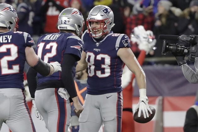 New England Patriots quarterback Tom Brady, left, celebrates his touchdown pass to tight end Matt LaCosse, right, in the first half of an NFL football game against the Buffalo Bills, Saturday, Dec. 21, 2019, in Foxborough, Mass. Brady[s touchdown pass was the 539th of his career, tying Peyton Manning for second all-time most touchdown passes by an NFL quarterback. (AP Photo/Elise Amendola)