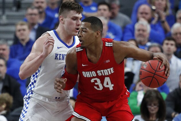 Ohio State's Kaleb Wesson (34) drives into Kentucky's Nate Sestina during the first half of an NCAA college basketball game Saturday, Dec. 21, 2019, in Las Vegas. (AP Photo/John Locher)