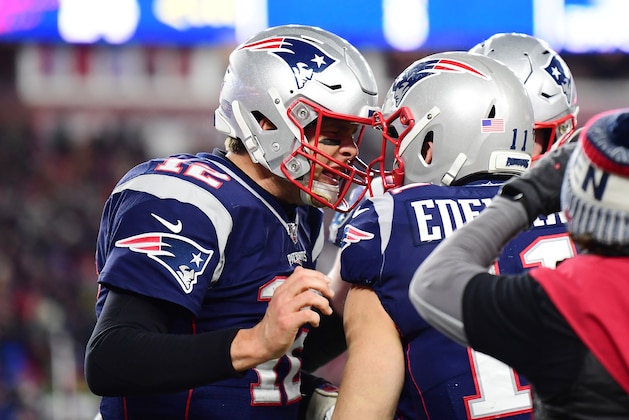 FOXBOROUGH, MASSACHUSETTS - DECEMBER 21: Julian Edelman #11 of the New England Patriots celebrates with Tom Brady #12 after connecting on a pass for a two point conversion during the fourth quarter against the Buffalo Bills in the game at Gillette Stadium on December 21, 2019 in Foxborough, Massachusetts. (Photo by Billie Weiss/Getty Images)