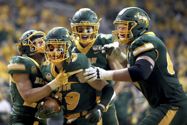 North Dakota State wide receiver Jimmy Kepouros (19) celebrates with teammates after scoring a touchdown during the FCS playoff NCAA college football game against Montana State, Saturday, Dec. 21, 2019, in Fargo, N.D. (AP Photo/Bruce Crummy)