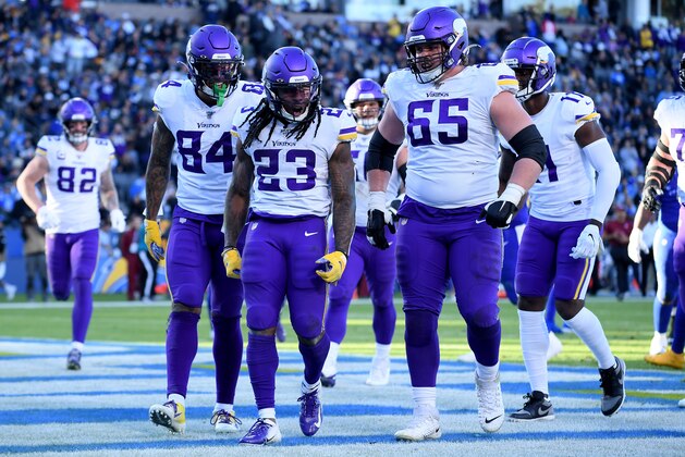 CARSON, CALIFORNIA - DECEMBER 15:  Mike Boone #23 of the Minnesota Vikings celebrates his touchdown with Irv Smith #84 and Pat Elflein #65, to take a 32-10 lead over the Los Angeles Chargers during the fourth quarter at Dignity Health Sports Park on December 15, 2019 in Carson, California. (Photo by Harry How/Getty Images)