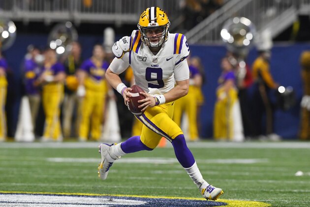 LSU quarterback Joe Burrow (9) runs down field against Georgia during the first half of the Southeastern Conference championship NCAA college football game, Saturday, Dec. 7, 2019, in Atlanta. (AP Photo/John Amis)