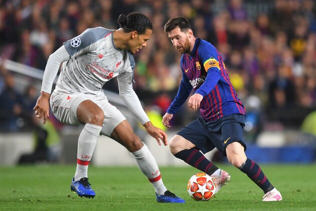 BARCELONA, SPAIN - MAY 01: Virgil van Dijk of Liverpool and Lionel Messi of Barcelona in action during the UEFA Champions League Semi Final first leg match between Barcelona and Liverpool at the Nou Camp on May 01, 2019 in Barcelona, Spain. (Photo by Michael Regan/Getty Images)