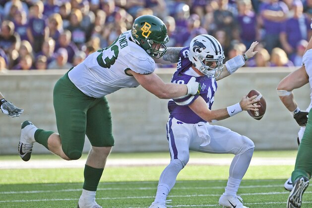 MANHATTAN, KS - OCTOBER 05:  Defensive tackle James Lynch #93 of the Baylor Bears sacks quarterback Skylar Thompson #10 of the Kansas State Wildcats during the second half at Bill Snyder Family Football Stadium on October 5, 2019 in Manhattan, Kansas. (Photo by Peter G. Aiken/Getty Images)