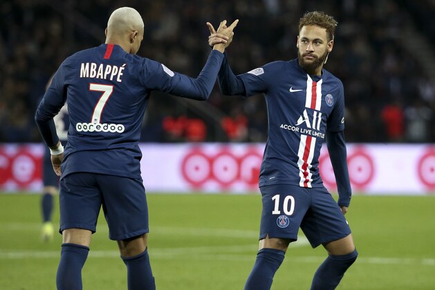 PARIS, FRANCE - DECEMBER 21: Neymar Jr of PSG celebrates his goal with Kylian Mbappe  (left) during the Ligue 1 match between Paris Saint-Germain (PSG) and Amiens SC at Parc des Princes stadium on December 21, 2019 in Paris, France. (Photo by Jean Catuffe/Getty Images)