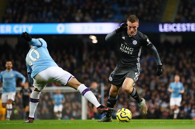 MANCHESTER, ENGLAND - DECEMBER 21: Jamie Vardy of Leicester City runs with the ball past Nicolas Otamendi of Manchester City during the Premier League match between Manchester City and Leicester City at Etihad Stadium on December 21, 2019 in Manchester, United Kingdom. (Photo by Clive Brunskill/Getty Images)