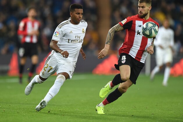 MADRID, SPAIN - DECEMBER 22: Rodrygo of Real Madrid battles for possession with Inigo Martinez of Athletic Club during the Liga match between Real Madrid CF and Athletic Club at Estadio Santiago Bernabeu on December 22, 2019 in Madrid, Spain. (Photo by Denis Doyle/Getty Images)