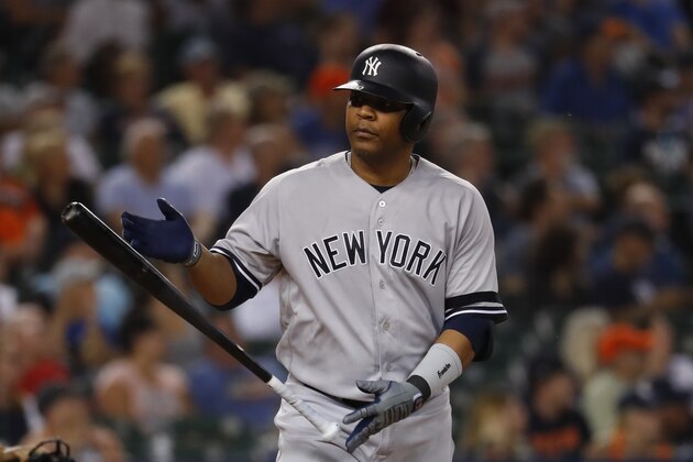 New York Yankees' Edwin Encarnacion tosses his bat after hitting a two-run home run in the seventh inning of a baseball game against the Detroit Tigers in Detroit, Tuesday, Sept. 10, 2019. (AP Photo/Paul Sancya)