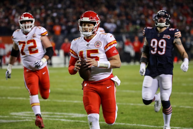CHICAGO, ILLINOIS - DECEMBER 22: Quarterback Patrick Mahomes #15 of the Kansas City Chiefs runs in a touchdown against outside linebacker Aaron Lynch #99 of the Chicago Bears in the first quarter of the game at Soldier Field on December 22, 2019 in Chicago, Illinois. (Photo by Jonathan Daniel/Getty Images)