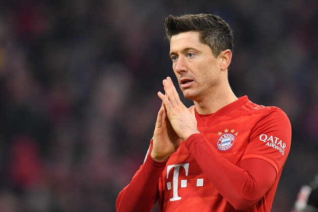 Bayern Munich's Polish striker Robert Lewandowski reacts during the German first division Bundesliga football match FC Bayern Munich vs Bayer 04 Leverkusen in Munich, southern Germany, on November 30, 2019. (Photo by Christof STACHE / AFP) / RESTRICTIONS: DFL REGULATIONS PROHIBIT ANY USE OF PHOTOGRAPHS AS IMAGE SEQUENCES AND/OR QUASI-VIDEO (Photo by CHRISTOF STACHE/AFP via Getty Images)