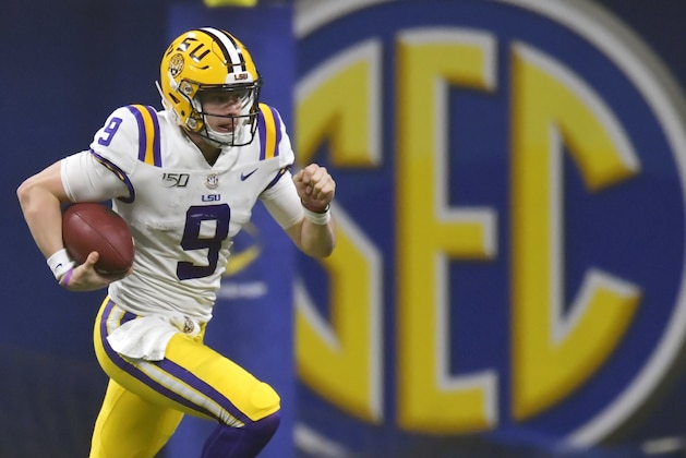 FILE - In this Dec. 7, 2019, file photo, LSU quarterback Joe Burrow (9) runs against Georgia during the second half of the Southeastern Conference championship NCAA college football game, in Atlanta. Burrow is a hero on LSU's Baton Rouge campus, but he hasn't seen much of it because he took graduate courses online. (AP Photo/Mike Stewart, File)