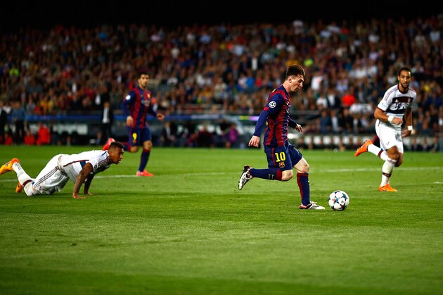 BARCELONA, SPAIN - MAY 06:  Lionel Messi of Barcelona passes by Jerome Boateng of Bayern to score his second goal during the first leg of UEFA Champions League semifinal match between FC Barcelona and FC Bayern Muenchen at Camp Nou on May 6, 2015 in Barcelona, Spain.  (Photo by Vladimir Rys Photography/Getty Images)
