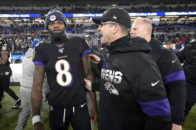 Baltimore Ravens quarterback Lamar Jackson (8) talks with head coach John Harbaugh, right, after an NFL football game against the New York Jets, Thursday, Dec. 12, 2019, in Baltimore. The Ravens won 42-21. (AP Photo/Nick Wass)