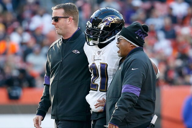 CLEVELAND, OH - DECEMBER 22:  Mark Ingram II #21 of the Baltimore Ravens is helped off of the field after getting injured during the fourth quarter at FirstEnergy Stadium on December 22, 2019 in Cleveland, Ohio. Baltimore defeated Cleveland 31-15. (Photo by Kirk Irwin/Getty Images)