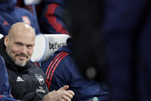 Arsenal's interim head coach Freddie Ljungberg looks out from the bench before the English Premier League soccer match between West Ham Utd and Arsenal at the London Stadium in London, Monday, Dec. 9, 2019. (AP Photo/Kirsty Wigglesworth)