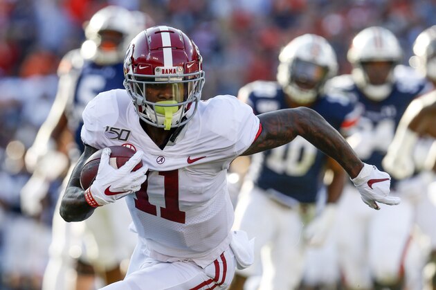 Alabama wide receiver Henry Ruggs III (11) carries the ball after a reception against Auburn during the first half of an NCAA college football game Saturday, Nov. 30, 2019, in Auburn, Ala. (AP Photo/Butch Dill)