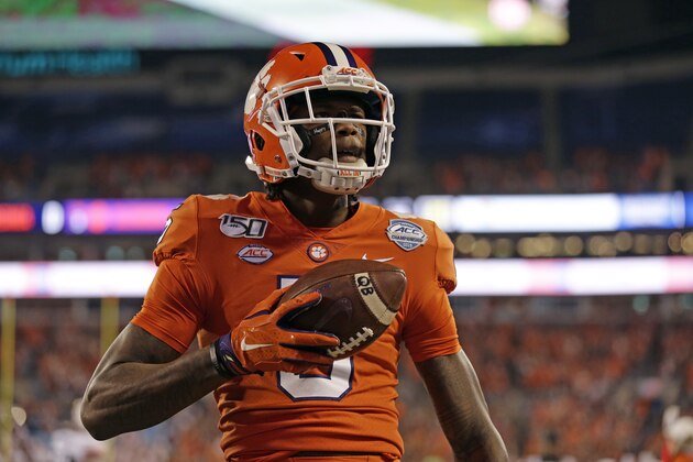 Clemson wide receiver Tee Higgins (5) reacts following his touchdown against Virginia duriung the first half of the Atlantic Coast Conference championship NCAA college football game in Charlotte, N.C., Saturday, Dec. 7, 2019. (AP Photo/Gerry Broome)