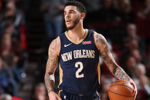 PORTLAND, OR - DECEMBER 23: Lonzo Ball #2 of the New Orleans Pelicans handles the ball against the Portland Trail Blazers on December 23, 2019 at the Moda Center in Portland, Oregon. NOTE TO USER: User expressly acknowledges and agrees that, by downloading and or using this Photograph, user is consenting to the terms and conditions of the Getty Images License Agreement. Mandatory Copyright Notice: Copyright 2019 NBAE (Photo by Sam Forencich/NBAE via Getty Images)