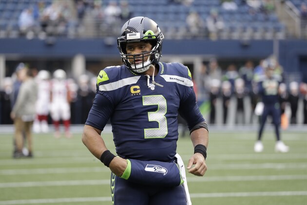 Seattle Seahawks quarterback Russell Wilson stands on the field during warmups before an NFL football game against the Arizona Cardinals, Sunday, Dec. 22, 2019, in Seattle. (AP Photo/Elaine Thompson)