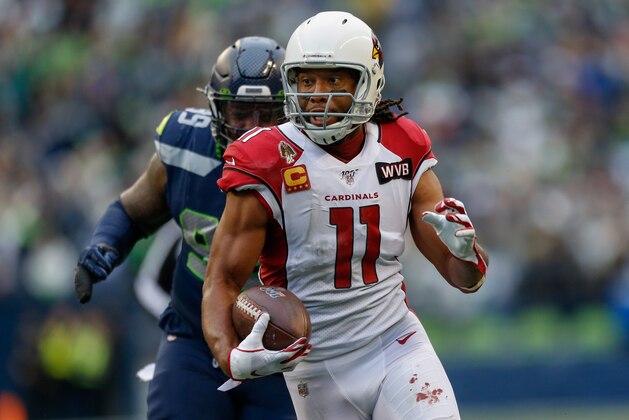 SEATTLE, WA - DECEMBER 22:  Wide receiver Larry Fitzgerald #11 of the Arizona Cardinals rushes for a touchdown in the second quarter against the Seattle Seahawks at CenturyLink Field on December 22, 2019 in Seattle, Washington.  (Photo by Otto Greule Jr/Getty Images)