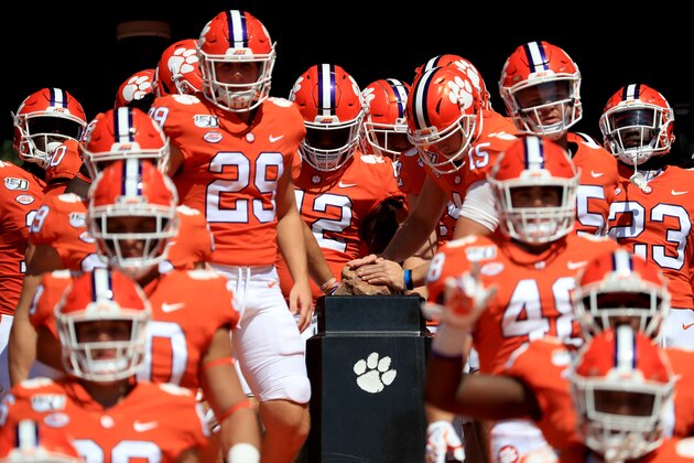 CLEMSON, SOUTH CAROLINA - SEPTEMBER 07: The Clemson Tigers touch Howard's Rock as they run onto the field before their game against the Texas A&M Aggies at Memorial Stadium on September 07, 2019 in Clemson, South Carolina. (Photo by Streeter Lecka/Getty Images)