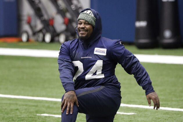 Seattle Seahawks running back Marshawn Lynch stretches during warmups at the NFL football team's practice facility Tuesday, Dec. 24, 2019, in Renton, Wash. When Lynch played his last game for the Seahawks in 2016, the idea of him ever wearing a Seahawks uniform again seemed preposterous. Yet, here are the Seahawks getting ready to have Lynch potentially play a major role Sunday against San Francisco with the NFC West title on the line. (AP Photo/Elaine Thompson)