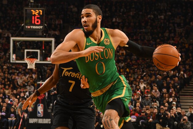 TORONTO, CANADA - DECEMBER 25: Jayson Tatum #0 of the Boston Celtics handles the ball against the Toronto Raptors on December 25, 2019 at the Scotiabank Arena in Toronto, Ontario, Canada.  NOTE TO USER: User expressly acknowledges and agrees that, by downloading and or using this Photograph, user is consenting to the terms and conditions of the Getty Images License Agreement.  Mandatory Copyright Notice: Copyright 2019 NBAE (Photo by Ron Turenne/NBAE via Getty Images)
