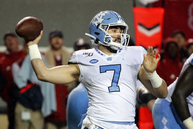 North Carolina quarterback Sam Howell (7) passes the ball against North Carolina State during the first half of an NCAA college football game in Raleigh, N.C., Saturday, Nov. 30, 2019. (AP Photo/Karl B DeBlaker)