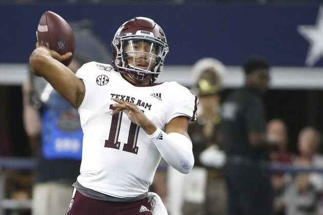 Texas A&M quarterback Kellen Mond (11) throws down field against Arkansas during the first half of an NCAA college football game Saturday, Sept. 28, 2019, in Arlington, Texas. (AP Photo/Ron Jenkins)