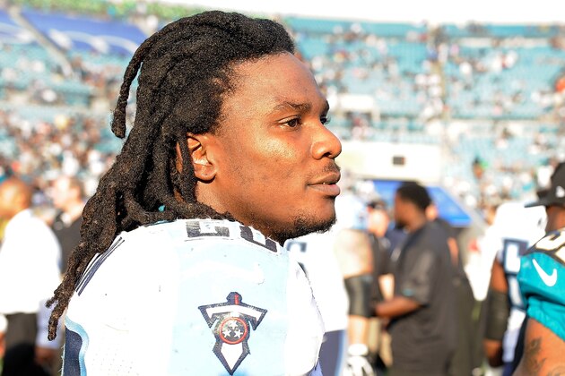 JACKSONVILLE, FL - DECEMBER 22:  Chris Johnson #28 of the Tennessee Titans stands at midfield following a game against the Jacksonville Jaguars at EverBank Field on December 22, 2013 in Jacksonville, Florida.  Tennessee won the game 20-16.  (Photo by Stacy Revere/Getty Images)