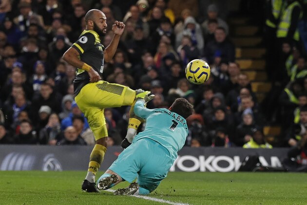 Southampton's English midfielder Nathan Redmond (L) chips the ball over Chelsea's Spanish goalkeeper Kepa Arrizabalaga (R) for their second goal during the English Premier League football match between Chelsea and Southampton at Stamford Bridge in London on December 26, 2019. (Photo by Adrian DENNIS / AFP) / RESTRICTED TO EDITORIAL USE. No use with unauthorized audio, video, data, fixture lists, club/league logos or 'live' services. Online in-match use limited to 120 images. An additional 40 images may be used in extra time. No video emulation. Social media in-match use limited to 120 images. An additional 40 images may be used in extra time. No use in betting publications, games or single club/league/player publications. /  (Photo by ADRIAN DENNIS/AFP via Getty Images)