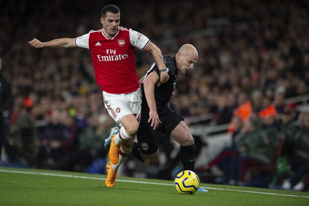 LONDON, ENGLAND - DECEMBER 05: Granit Xhaka of Arsenal and Aaron Mooy of Brighton and Hove Albion during to the Premier League match between Arsenal FC and Brighton & Hove Albion at Emirates Stadium on December 05, 2019 in London, United Kingdom. (Visionhaus)