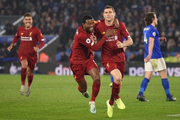 Liverpool's English midfielder James Milner (2nd R) celebrates with teammates after scoring their second goal from the penalty spot during the English Premier League football match between Leicester City and Liverpool at King Power Stadium in Leicester, central England on December 26, 2019. (Photo by Oli SCARFF / AFP) / RESTRICTED TO EDITORIAL USE. No use with unauthorized audio, video, data, fixture lists, club/league logos or 'live' services. Online in-match use limited to 120 images. An additional 40 images may be used in extra time. No video emulation. Social media in-match use limited to 120 images. An additional 40 images may be used in extra time. No use in betting publications, games or single club/league/player publications. / (Photo by OLI SCARFF/AFP via Getty Images) Liverpool's English midfielder James Milner (2nd R) celebrates with teammates after scoring their second goal from the penalty spot during the English Premier League football match between Leicester City and Liverpool at King Power Stadium in Leicester, central England on December 26, 2019. (Photo by Oli SCARFF / AFP) / RESTRICTED TO EDITORIAL USE. No use with unauthorized audio, video, data, fixture lists, club/league logos or 'live' services. Online in-match use limited to 120 images. An additional 40 images may be used in extra time. No video emulation. Social media in-match use limited to 120 images. An additional 40 images may be used in extra time. No use in betting publications, games or single club/league/player publications. / (Photo by OLI SCARFF/AFP via Getty Images)