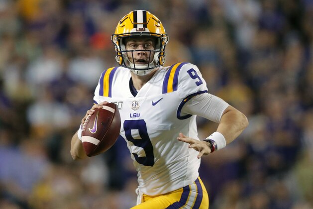 FILE - In this Nov. 30, 2019, file photo, LSU quarterback Joe Burrow (9) scrambles during the first half of an NCAA college football game against Texas A&M, in Baton Rouge, La. LSU quarterback Joe Burrow is The Associated Press college football player of the year in a landslide vote.  Burrow, who has led the top-ranked Tigers to an unbeaten season and their first College Football Playoff appearance, received 50 of 53 first-place votes from AP Top 25 poll voters and a total of 156 points.  (AP Photo/Gerald Herbert, File)
