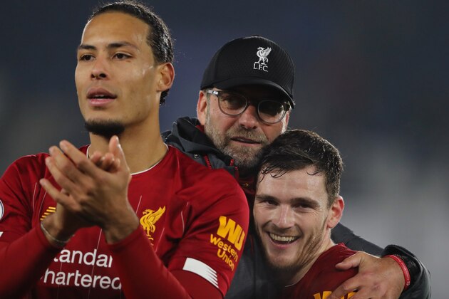 LEICESTER, ENGLAND - DECEMBER 26: Juergen Klopp the hehad coach / manager of Liverpool celebrates victory with Andrew Robertson during the Premier League match between Leicester City and Liverpool FC at The King Power Stadium on December 26, 2019 in Leicester, United Kingdom. (Photo by Matthew Ashton - AMA/Getty Images)