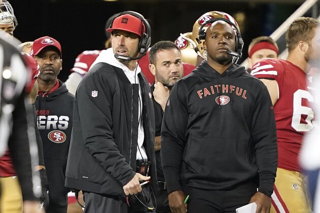 San Francisco 49ers head coach Kyle Shanahan, center, during the first half of an NFL football game against the Los Angeles Rams in Santa Clara, Calif., Saturday, Dec. 21, 2019. (AP Photo/Tony Avelar)