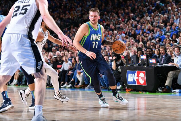 DALLAS, TX - DECEMBER 26: Luka Doncic #77 of the Dallas Mavericks dribbles the ball against the San Antonio Spurs on December 26, 2019 at the American Airlines Center in Dallas, Texas. NOTE TO USER: User expressly acknowledges and agrees that, by downloading and or using this photograph, User is consenting to the terms and conditions of the Getty Images License Agreement. Mandatory Copyright Notice: Copyright 2019 NBAE (Photo by Glenn James/NBAE via Getty Images)