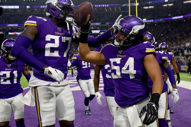 MINNEAPOLIS, MINNESOTA - DECEMBER 23: Middle linebacker Eric Kendricks #54 of the Minnesota Vikings celebrates with Jayron Kearse #27 after recovering a fumble by running back Aaron Jones #33 of the Green Bay Packers in the first quarter of the game at U.S. Bank Stadium on December 23, 2019 in Minneapolis, Minnesota. (Photo by Stephen Maturen/Getty Images)