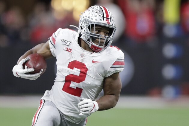 Ohio State running back J.K. Dobbins (2) runs during the first half of the Big Ten championship NCAA college football game against Wisconsin, Saturday, Dec. 7, 2019, in Indianapolis. (AP Photo/Michael Conroy)
