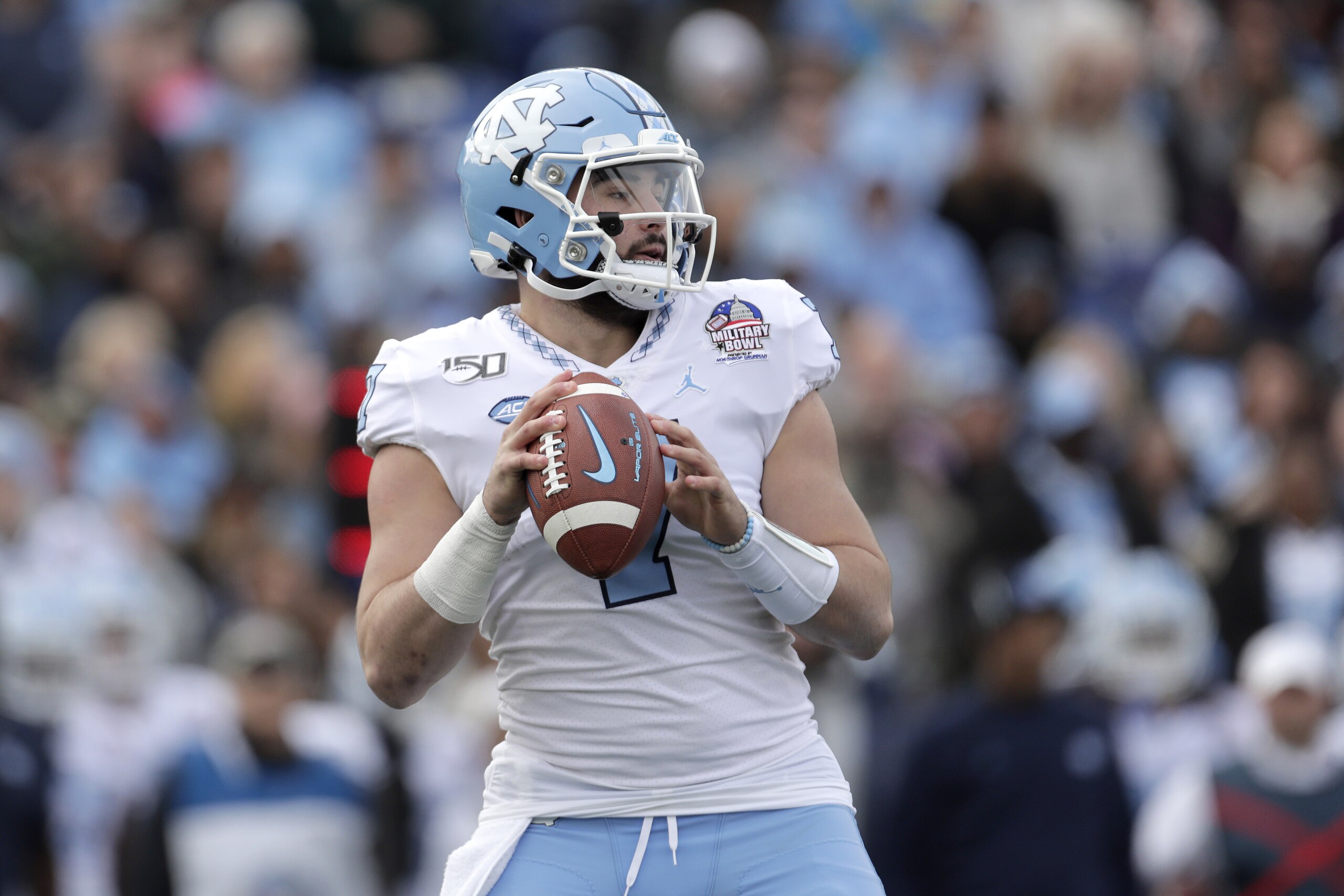 North Carolina quarterback Sam Howell looks to pass against Temple during the first half of the Military Bowl NCAA college football game, Friday, Dec. 27, 2019, in Annapolis, Md. (AP Photo/Julio Cortez) North Carolina quarterback Sam Howell looks to pass against Temple during the first half of the Military Bowl NCAA college football game, Friday, Dec. 27, 2019, in Annapolis, Md. (AP Photo/Julio Cortez)