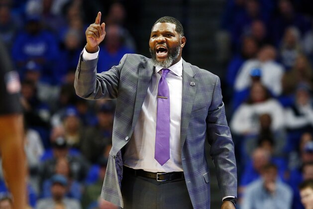 Evansville coach Walter McCarty shouts during the second half of the team's NCAA college basketball game against Kentucky in Lexington, Ky., Tuesday, Nov. 12, 2019. Evansville won 67-64. (AP Photo/James Crisp)