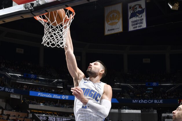 ORLANDO, FL - DECEMBER 27: Nikola Vucevic #9 of the Orlando Magic dunks the ball during the game against the Philadelphia 76ers on December 27, 2019 at Amway Center in Orlando, Florida. NOTE TO USER: User expressly acknowledges and agrees that, by downloading and or using this photograph, User is consenting to the terms and conditions of the Getty Images License Agreement. Mandatory Copyright Notice: Copyright 2019 NBAE (Photo by Fernando Medina/NBAE via Getty Images)