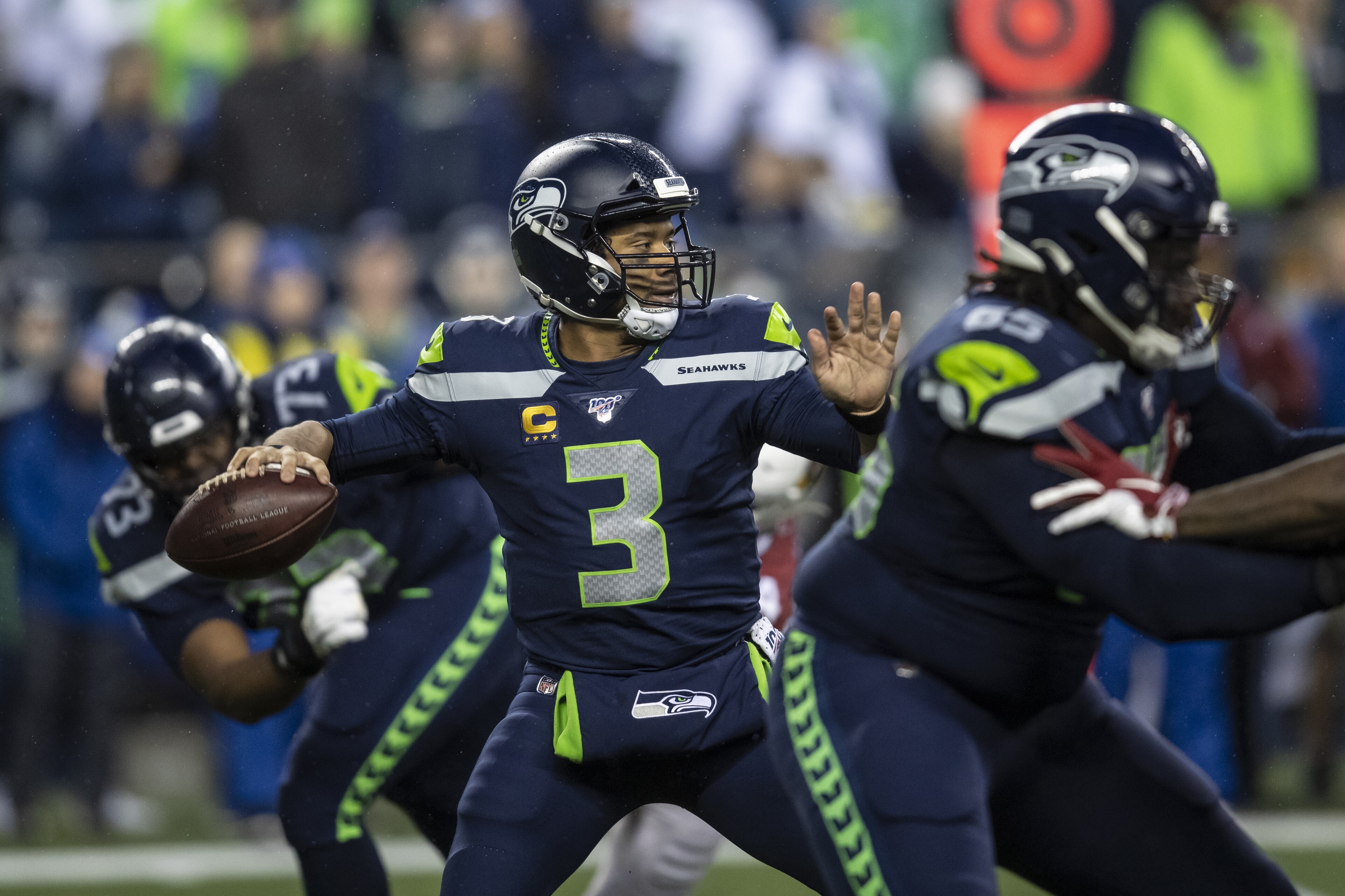 SEATTLE, WA - DECEMBER 22: Quarterback Russell Wilson #3 of the Seattle Seahawks passes the ball during game against the Arizona Cardinals at CenturyLink Field on December 22, 2019 in Seattle, Washington. The Cardinals won 27-13. (Photo by Stephen Brashear/Getty Images)