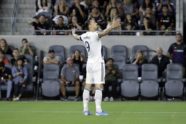 Los Angeles Galaxy's Zlatan Ibrahimovic (9) celebrates after scoring against Los Angeles FC during the first half of an MLS soccer match Sunday, Aug. 25, 2019, in Los Angeles. (AP Photo/Marcio Jose Sanchez)