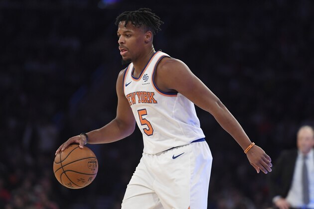 New York Knicks guard Dennis Smith Jr. (5) dribbles the ball during the first half of an NBA basketball game against the Milwaukee Bucks in New York, Saturday, Dec. 21, 2019. (AP Photo/Sarah Stier)